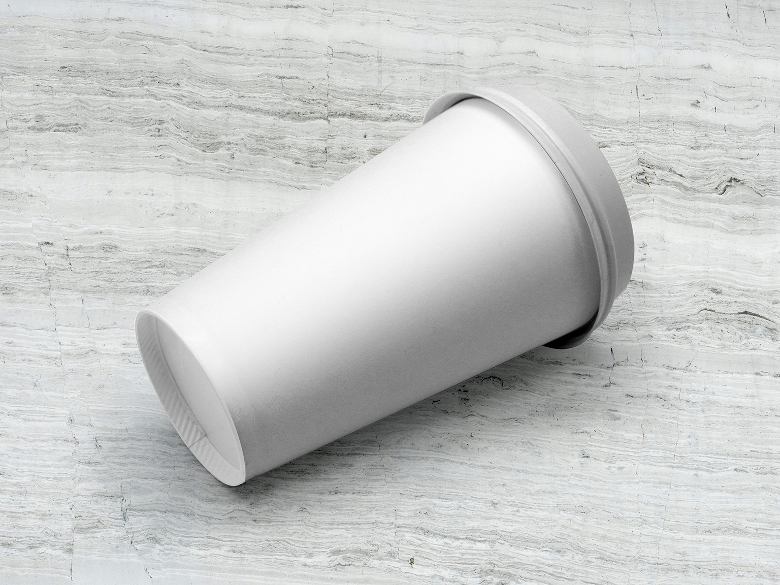 Coffee Cup Lying on Floor Mockup_OMID_Ghabl